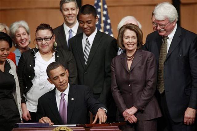Photograph of President Obama signing the reconciliation bill from the AP
